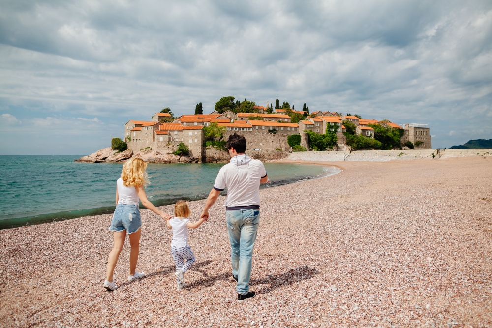 mother with children travel beach. Picturesque sea view.